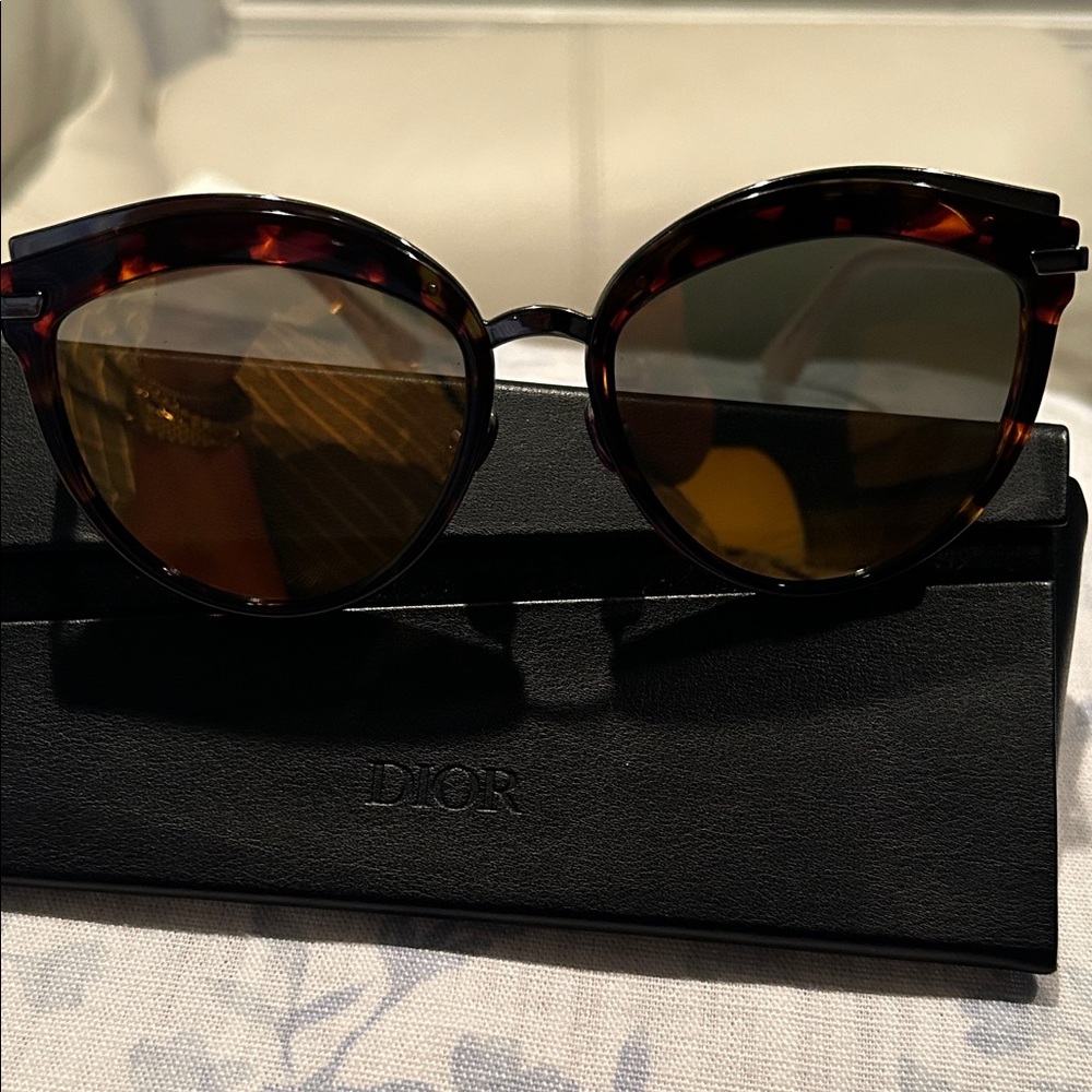 Dior Women's Brown Tortoise Sunglasses with pastel pink on the sides.